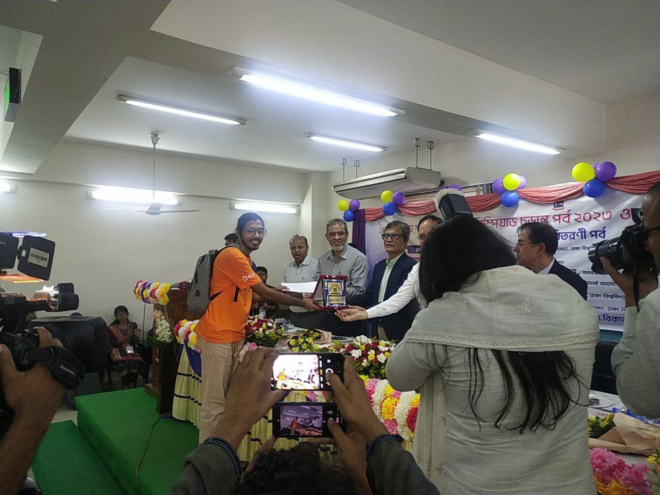 From left, Atuno and Soumitra collecting their first and second prizes from the judges