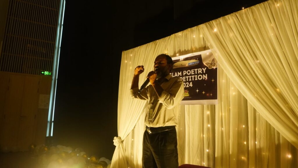 Eleas reciting his fierce poem at the Slam Poetry 2024. Photo: Rahid Ahmed