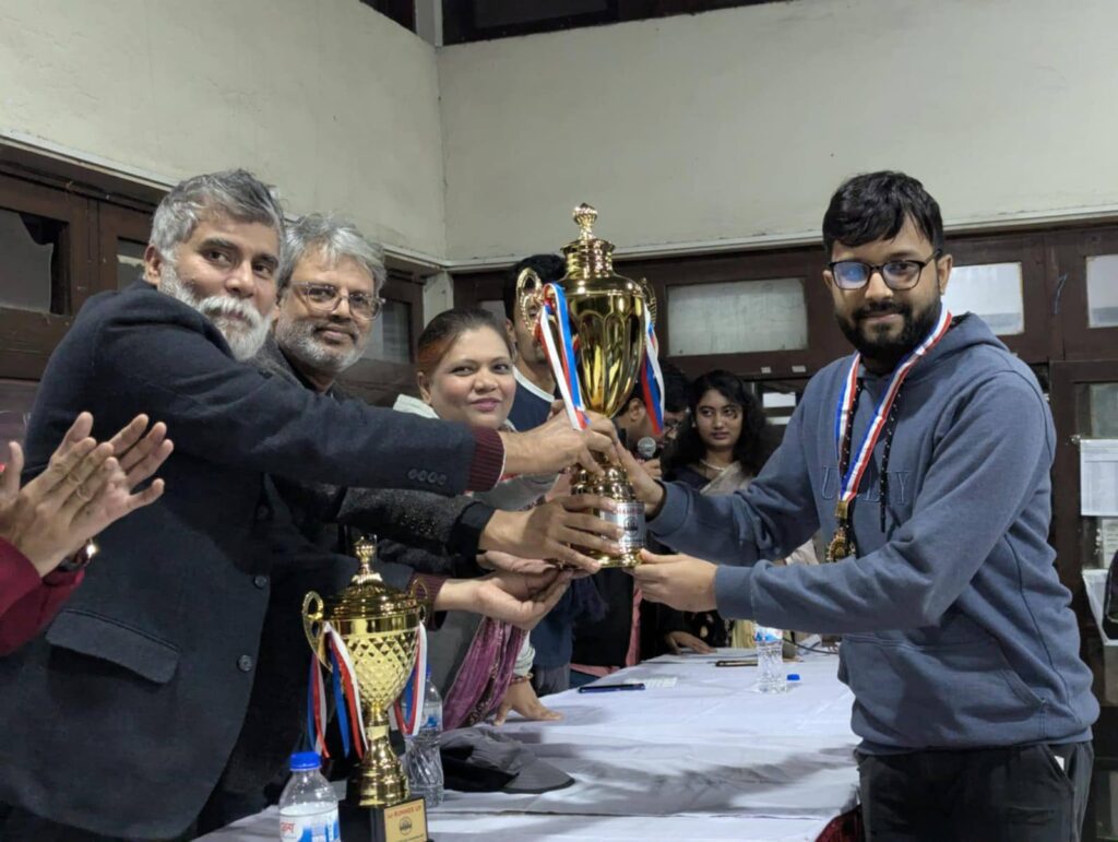 Anata Choudhury receiving his champion trophy at the prize giving ceremony. Photo : Collected