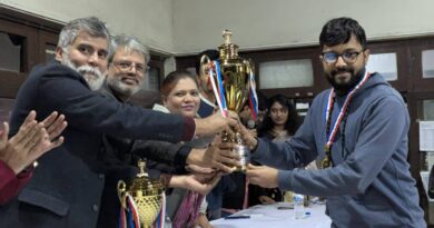 Anata Choudhury receiving his champion trophy at the prize giving ceremony. Photo : Collected