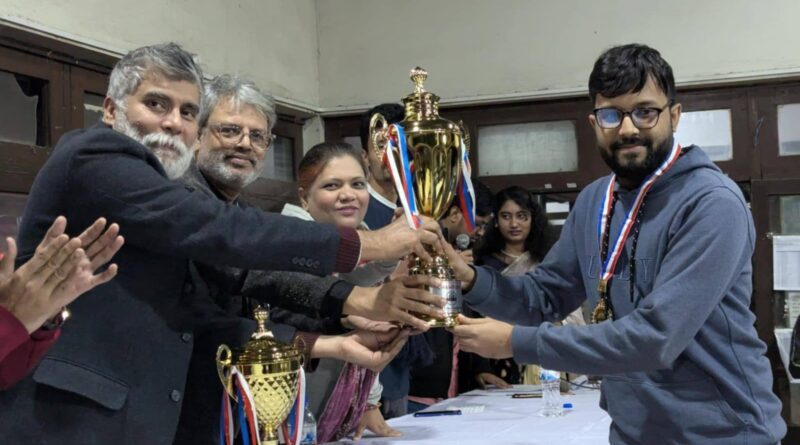 Anata Choudhury receiving his champion trophy at the prize giving ceremony. Photo : Collected